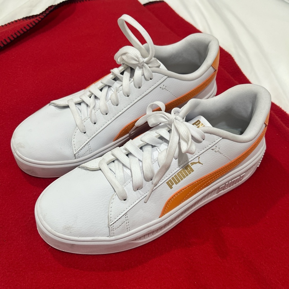 Puma White Sneakers with Vibrant Orange Accents